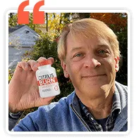 Testimonial photo: Neil C., 57 | Asheville, NC | Verified Buyer| Verified Buyer, smiling while promot  Bottle CitrusBurn .- review 2